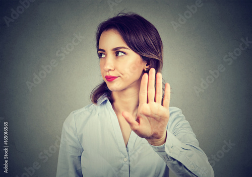Angry woman giving talk to hand gesture