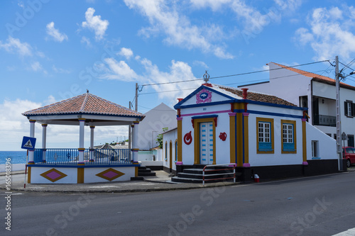 Sunny seascape with a colorful imperio near Angra do Heroismo, Terceira, Azores, Portugal