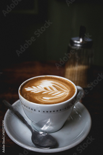 Cup of cappuccino on table