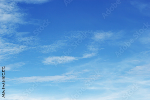 Soft white clouds against blue sky background and empty space for your design