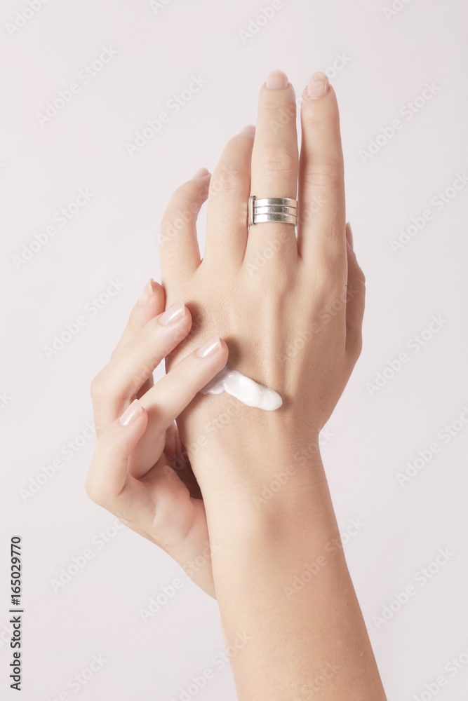 Woman applying hand cream