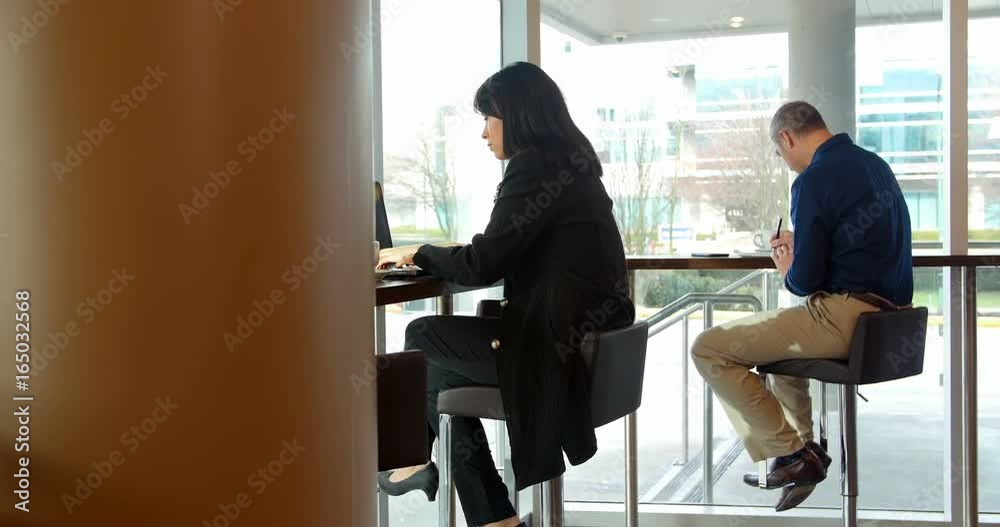 Executives working while having coffee Executives working while having coffee