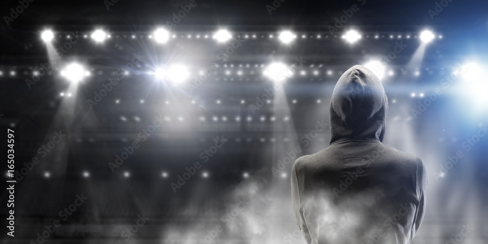 Fototapeta premium Silhouette of man in hoody