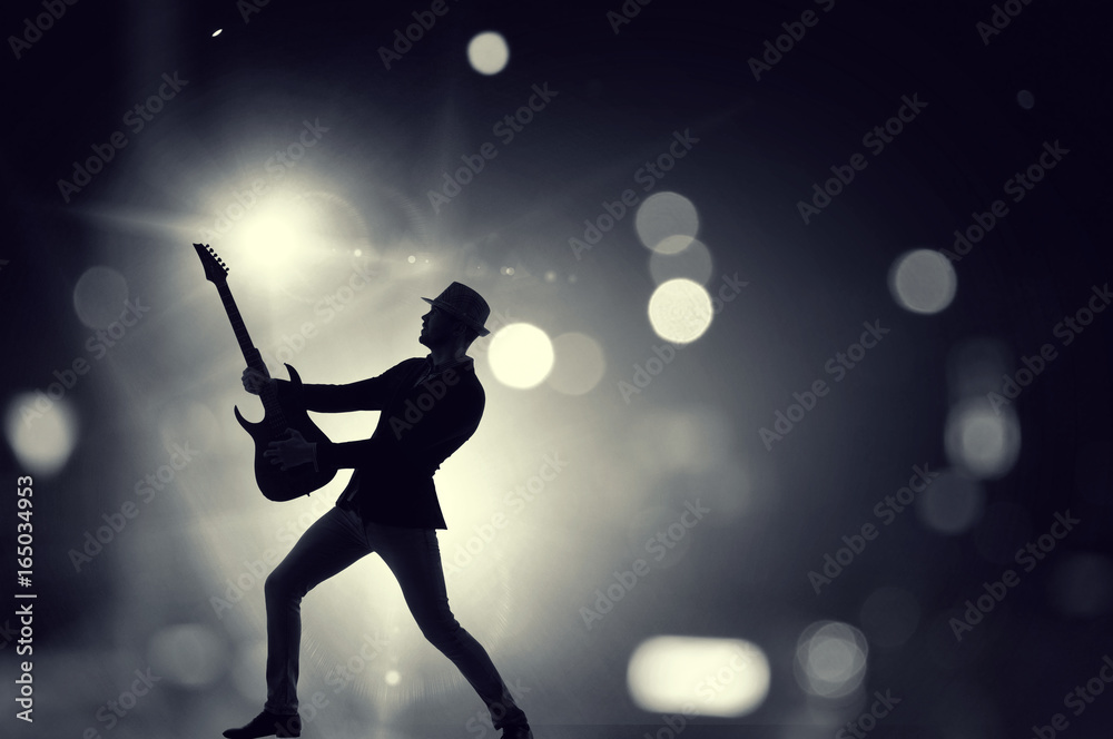 Fototapeta premium Rock guy with guitar. Mixed media