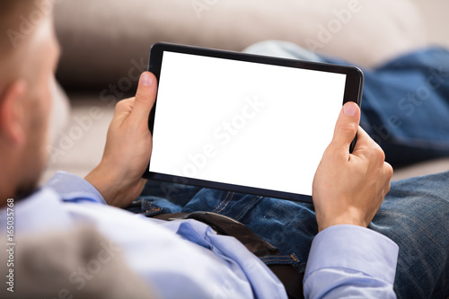 Man Holding Digital Tablet