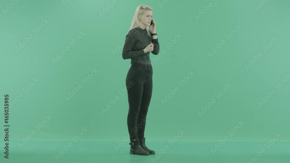 a young girl is working things out on the phone a young girl is working things out on the phone