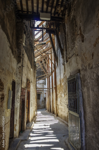 A narrow street at the Medina of Fez  Morocco