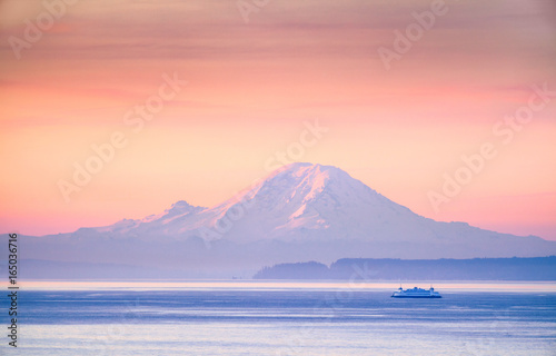 A ferry crossing the Puget Sound at sunrise with Mount Rainier in the background Fototapeta