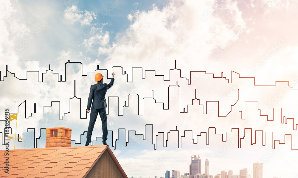 Man architect draw silhouette of modern city on blue sky. Mixed Man architect draw silhouette of modern city on blue sky. Mixed