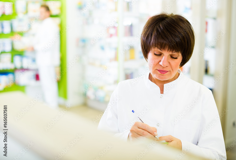 pharmacist working in shop