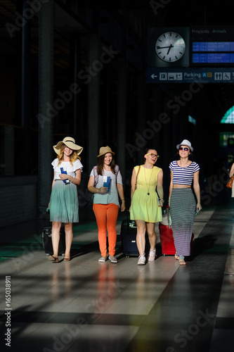 Group of cute girls at the railway station.