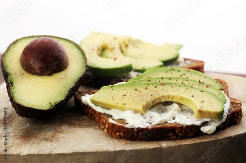 sliced avocado on toast bread with spices and avocado