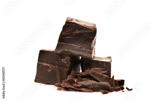 Broken dark chocolate on white background