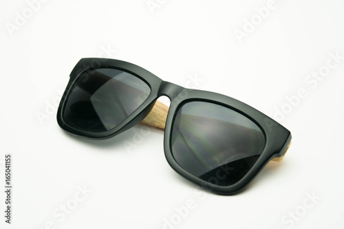 black sunglasses with wooden legs on white background