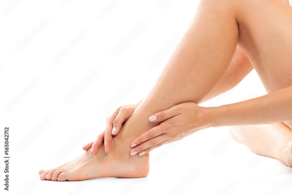 Beautiful women feet isolated on white close-up Beautiful women feet isolated on white close-up