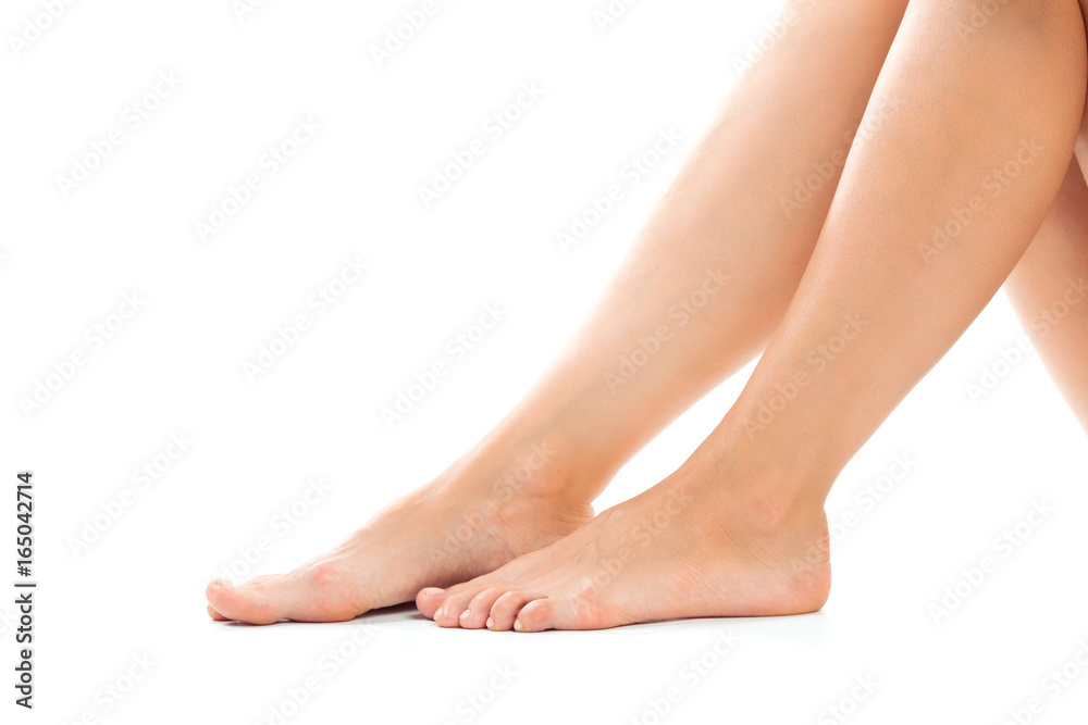 Beautiful women feet isolated on white close-up Beautiful women feet isolated on white close-up