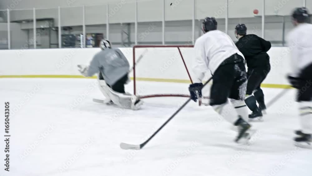 Tracking of ice hockey forward in black uniform pushing player in white