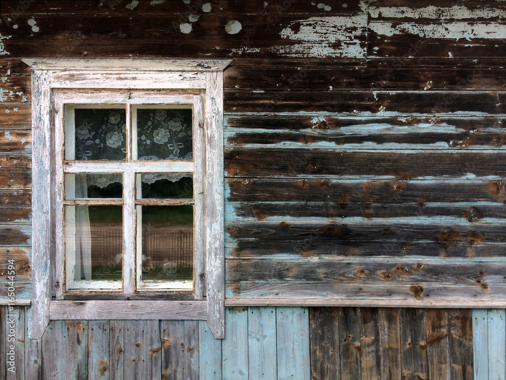 The window of the old house. Blue cracked paint The window of the old house. Blue cracked paint