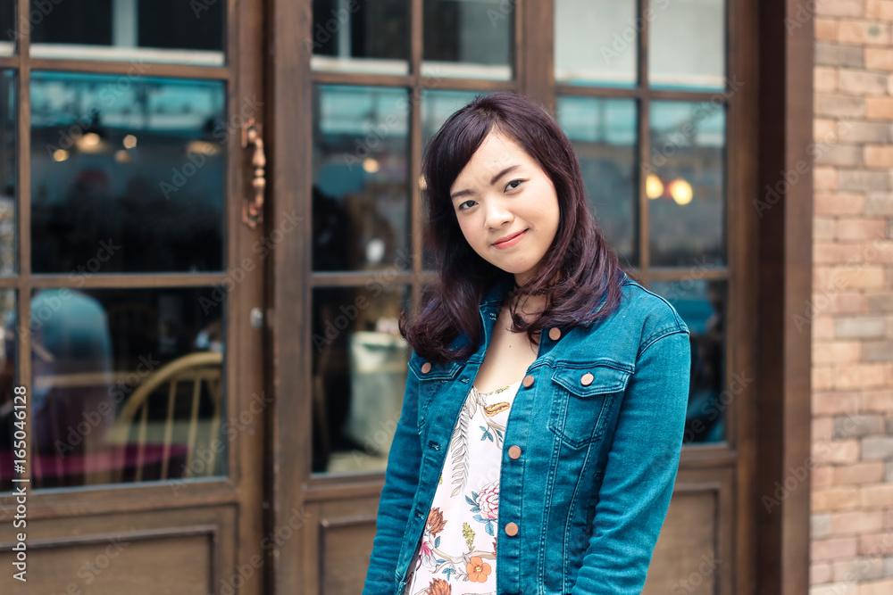 Happy beautiful Asian woman smiling with outdoor scene in vintage tone. Shopping and outdoor concept. Happy beautiful Asian woman smiling with outdoor scene in vintage tone. Shopping and outdoor concept.