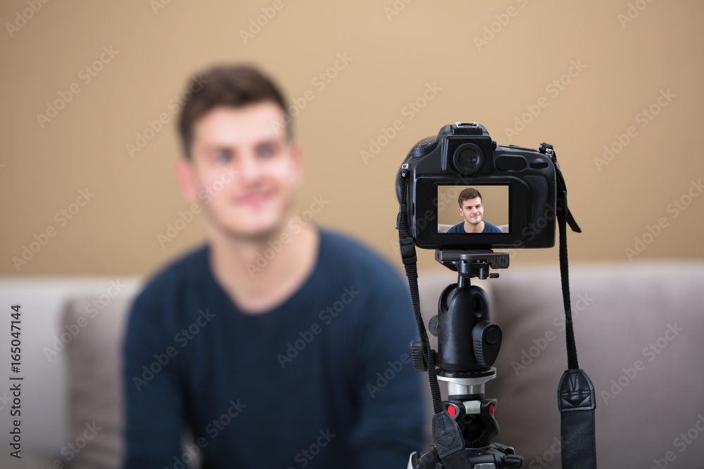 Blogger Recording Video With Camera