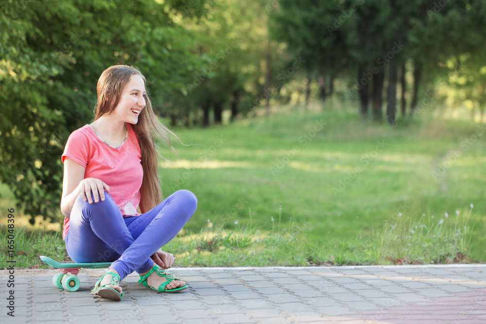 teen girls with with skateboard in summer park teen girls with with skateboard in summer park