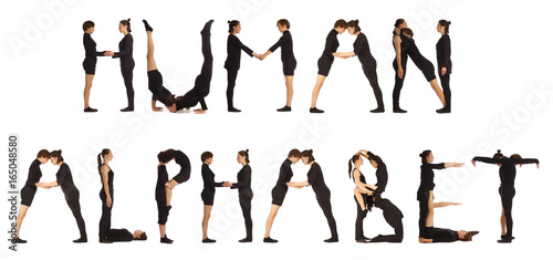Black dressed people forming HUMAN ALPHABET word