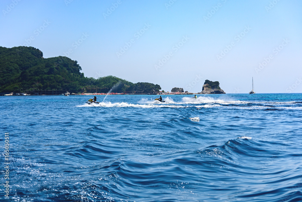 Naklejka premium Rest on the sea. A man on a water motorcycle