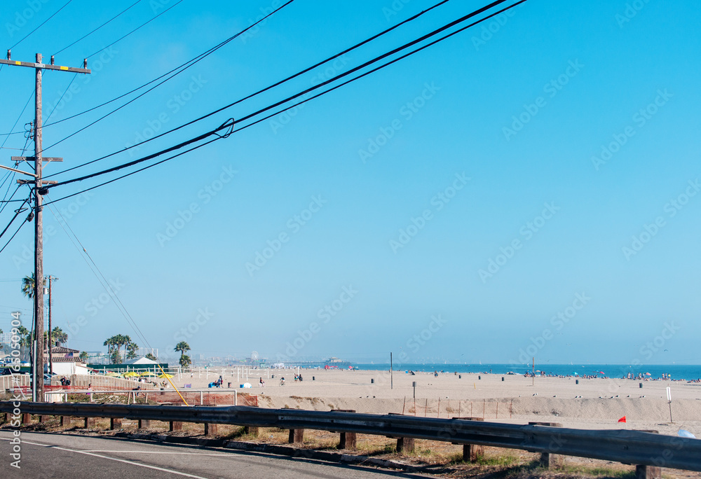 California beaches near Los Angeles city with a clear blue sky and yellow sand on the coast California beaches near Los Angeles city with a clear blue sky and yellow sand on the coast