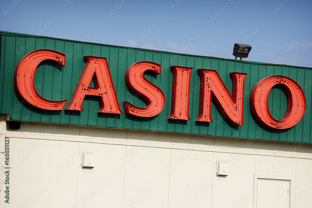 Obraz premium aged and worn vintage photo of neon casino sign