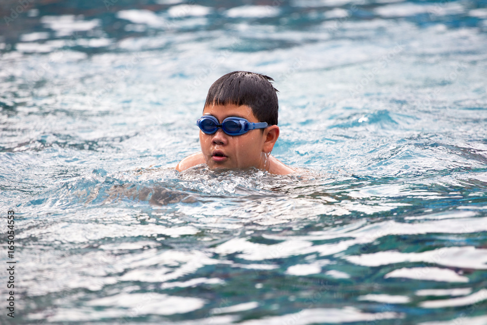 children swimming, Obese children are swimming.