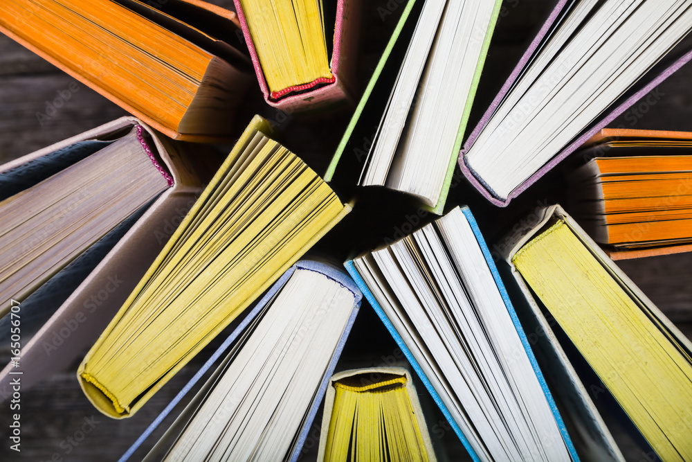 Naklejka premium Multicolored books, top view