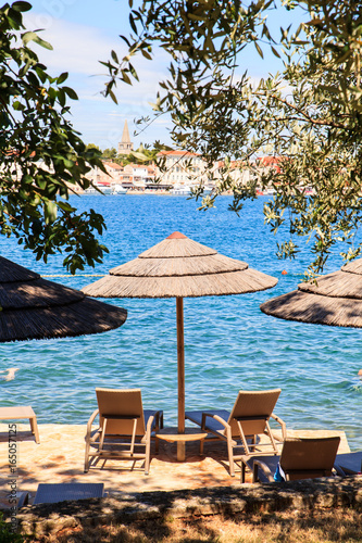 Beach umbrellas in Saint Nicholas island  Porec