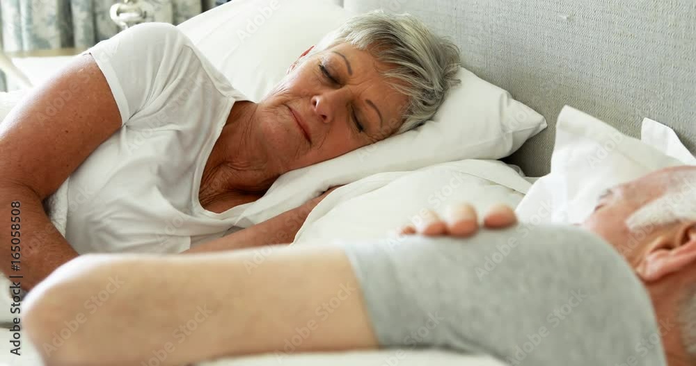 Senior couple sleeping in the bedroom Senior couple sleeping in the bedroom