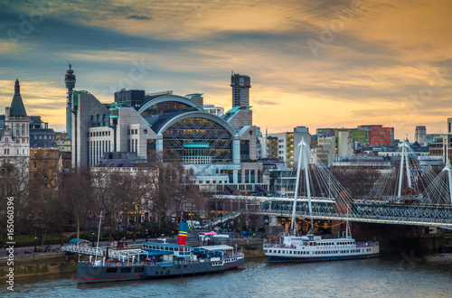 London, England - Beautiful sky and clouds at Charing Cross station and Golden Jubilee Bridge at Embankment before sunset