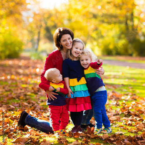 Mother and kids in autumn park