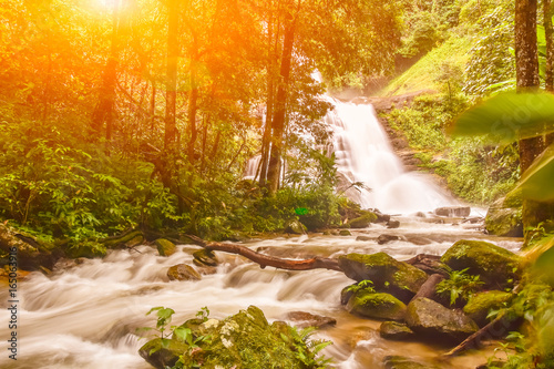 Huai Sai Lueang Waterfall with lens flare photo