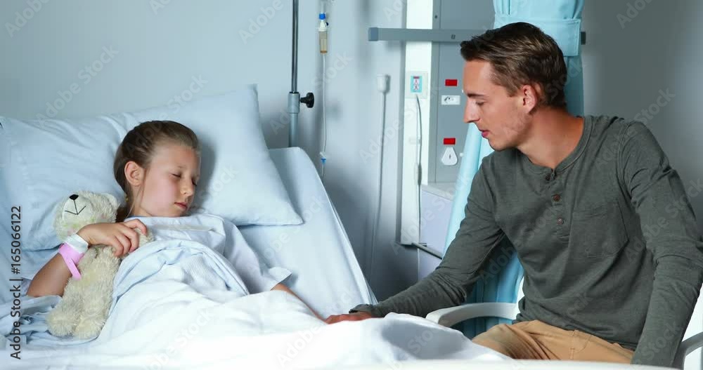 Father interacting with her sick daughter Father interacting with her sick daughter