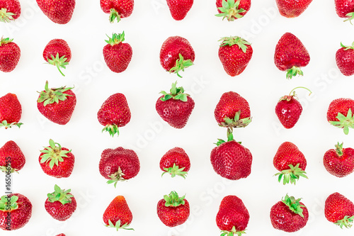 Tasty big strawberries on white background. Flat lay. Top view. Fruit pattern with summer berries