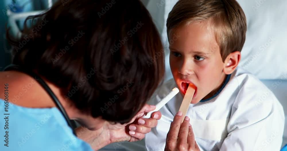 Female doctor examining patient mouth Female doctor examining patient mouth
