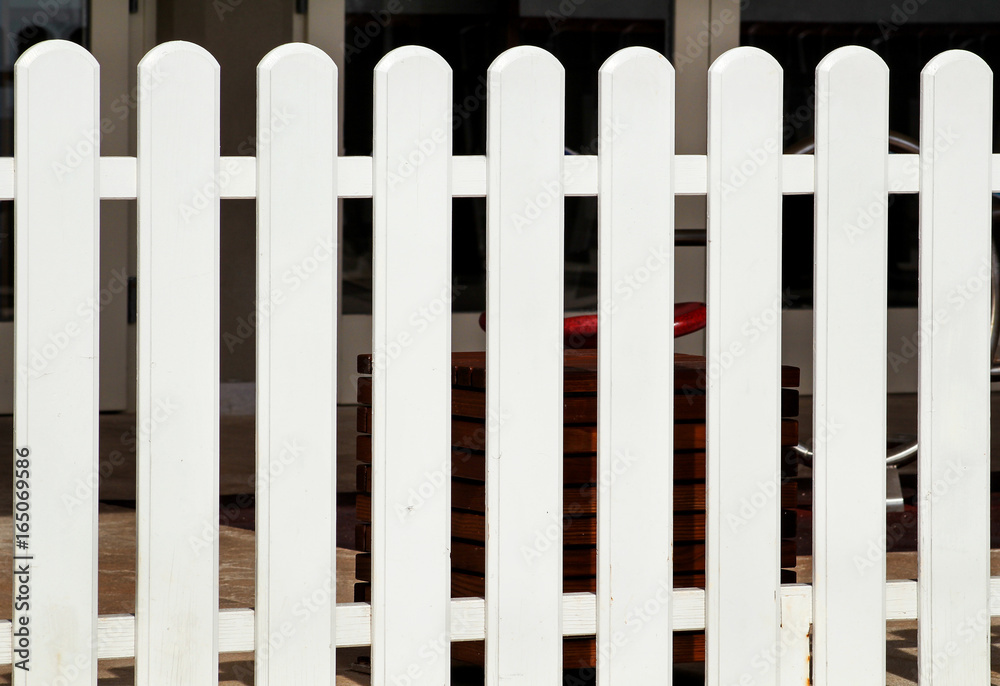 White wooden decorative fence isolated. Wooden plank panel background texture. Landscape architecture ideas, details, creative wallpaper. Traditional classic vintage design white wooden fence. White wooden decorative fence isolated. Wooden plank panel background texture. Landscape architecture ideas, details, creative wallpaper. Traditional classic vintage design white wooden fence.