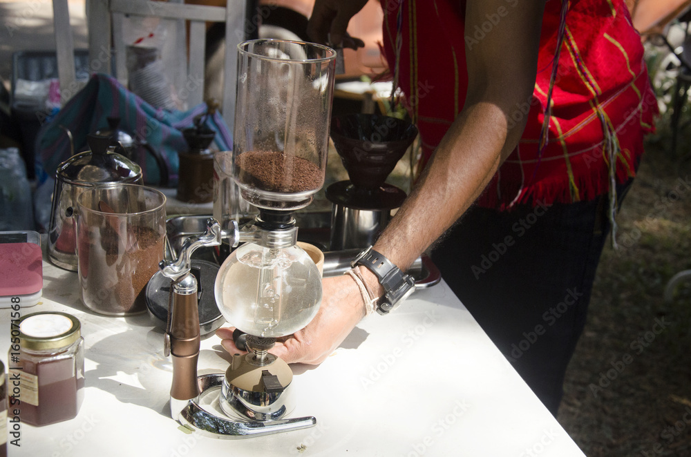 Thai people use Syphon Coffee Maker made hot coffee for show and sale
