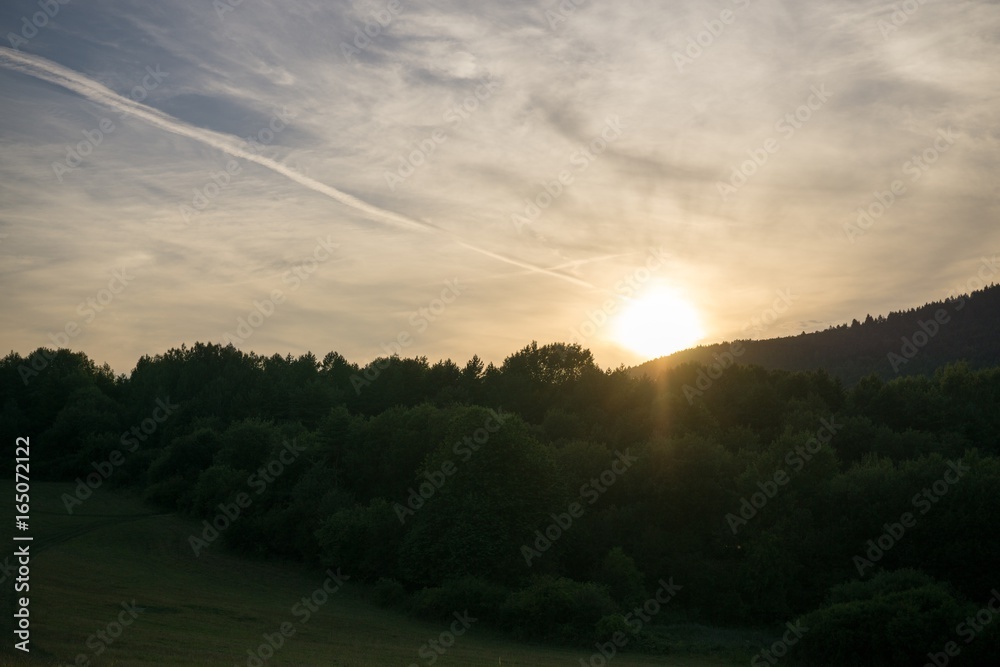Obraz premium Sunrise and sunset over the hills and town. Slovakia