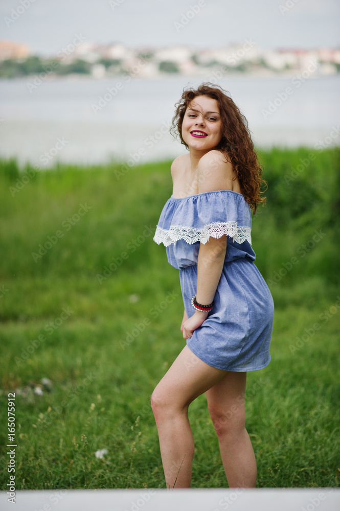 Portrait of a fantastic young girl having fun in the park next to the lake. Portrait of a fantastic young girl having fun in the park next to the lake.