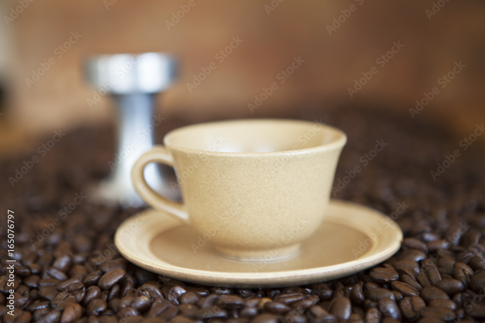 Coffee cup on coffee beans Coffee cup on coffee beans