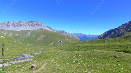 Aerial 4K - Stelvio National Park (IT) - Vista aerea del Passo dell'Umbrail (2503 mt.) Val Müstair sul confine Svizzero  photo