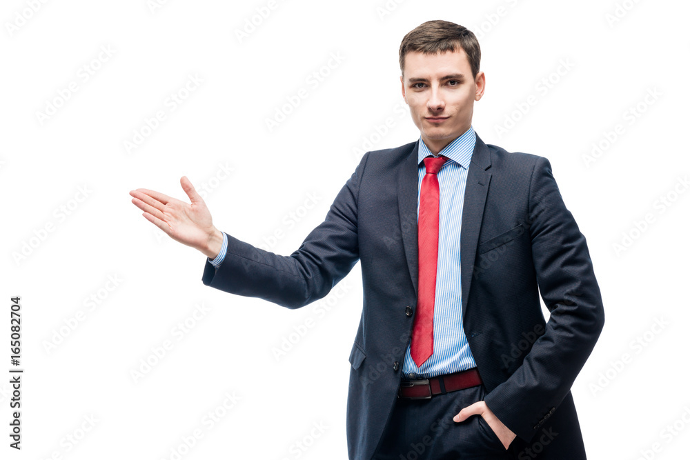 Young businessman showing his hand on something on a white background Young businessman showing his hand on something on a white background