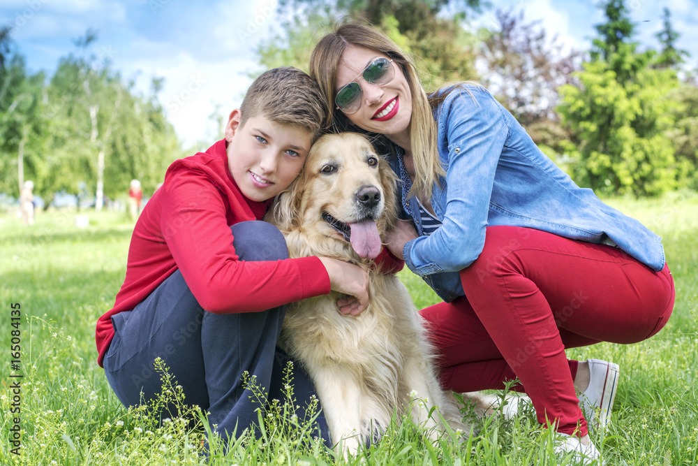 Fototapeta premium Mother, son and dog playing