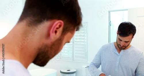 Wallpaper Mural Man brushing his teeth in bathroom Torontodigital.ca
