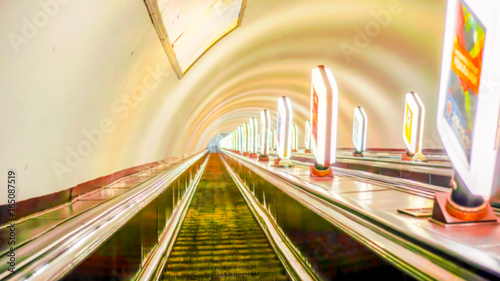 high escalators of the subway in big city