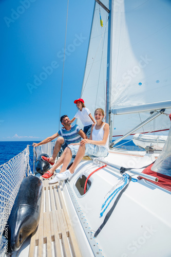 Father with adorable kids resting on yacht © Max Topchii